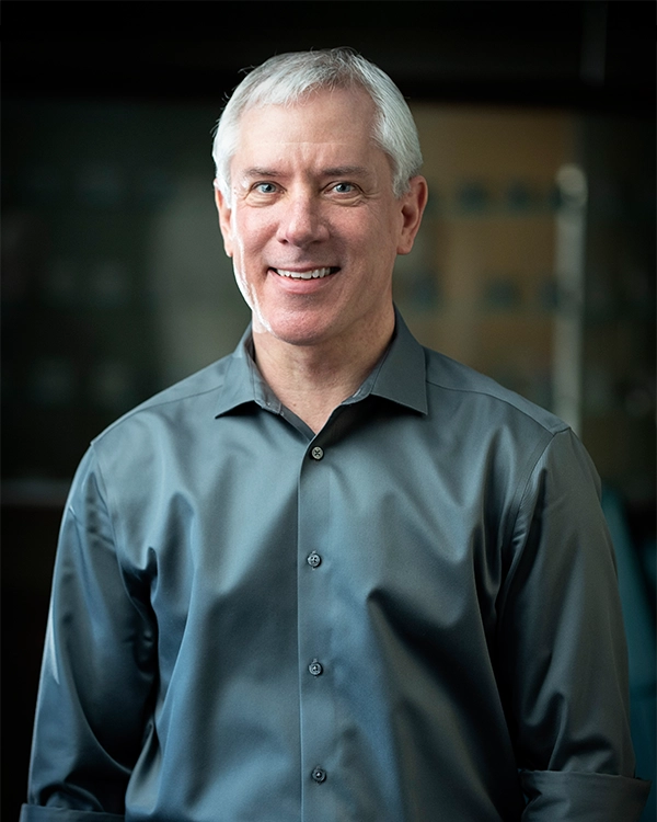 Orthodontist Avon CT Andrew Kuhlberg Andrew Kuhlberg Smiling In Grey Button Up Shirt