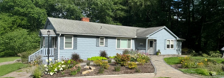 Orthodontist Avon CT Front Of Office With Garden Office Building At Kuhlberg Orthodontics With Flower Bed